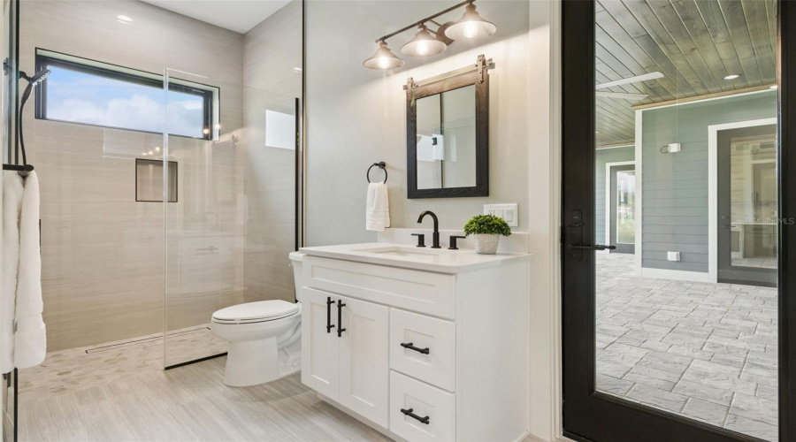 Bath With Quartz Vanity And Modern Fixtures
