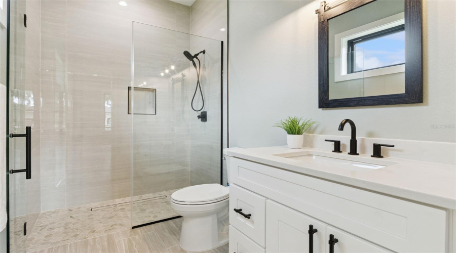 Walk-In Shower With Frameless Glass Enclosure