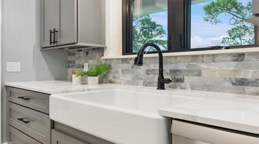 Farmhouse Sink Beneath Andersen Double-Pane Windows