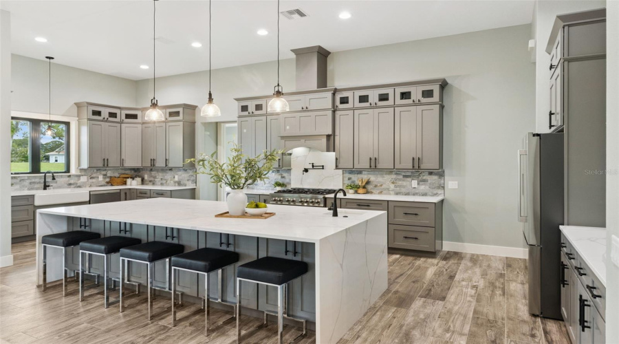 Chef'S Kitchen With Oversized Island, Solid Wood Cabinetry And Premium Finishes