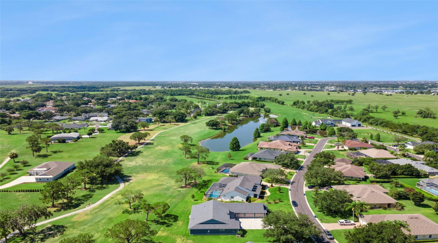Neighborhood Aerial Showcasing Golf Course Living