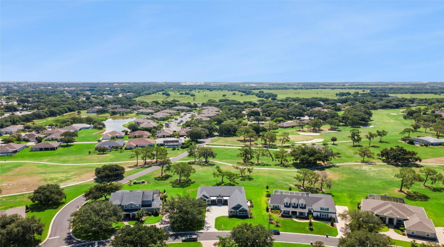 Neighborhood Aerial Showcasing Golf Course Living