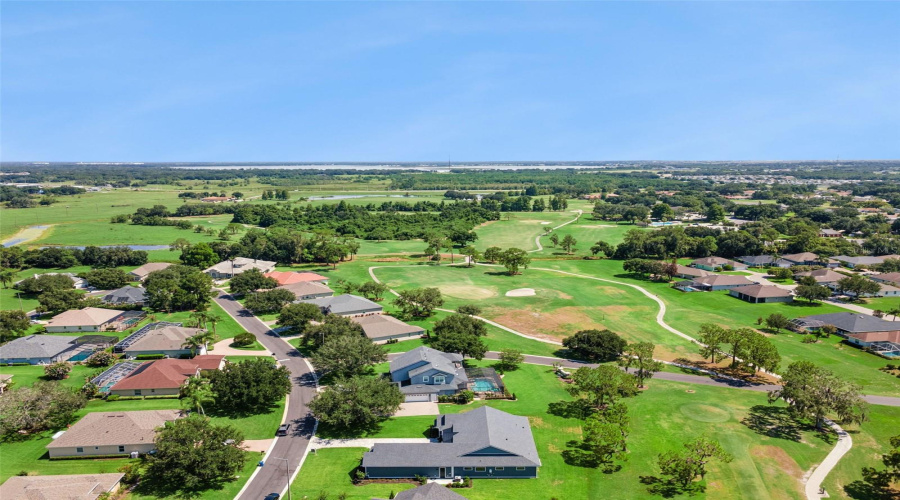 Neighborhood Aerial Showcasing Golf Course Living