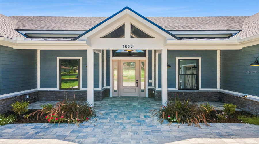 Covered Front Porch With Timeless Custom Farmhouse Architecture