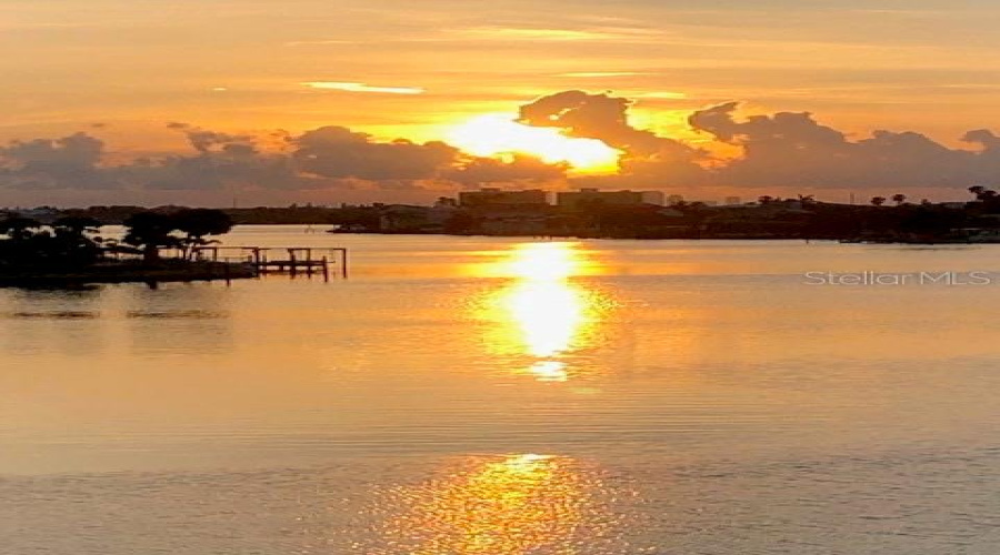 Sunrise With Rain Clouds On Boca Ciega Bay.