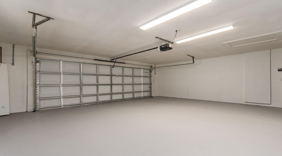 Large 2 Car Garage With Epoxy Floor Sealer.