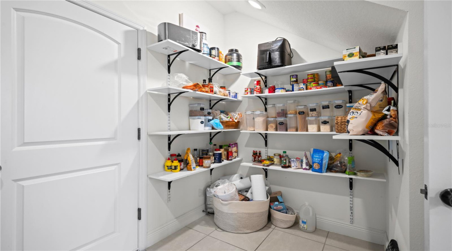 Custom Built Storage Shelves In Laundry Room