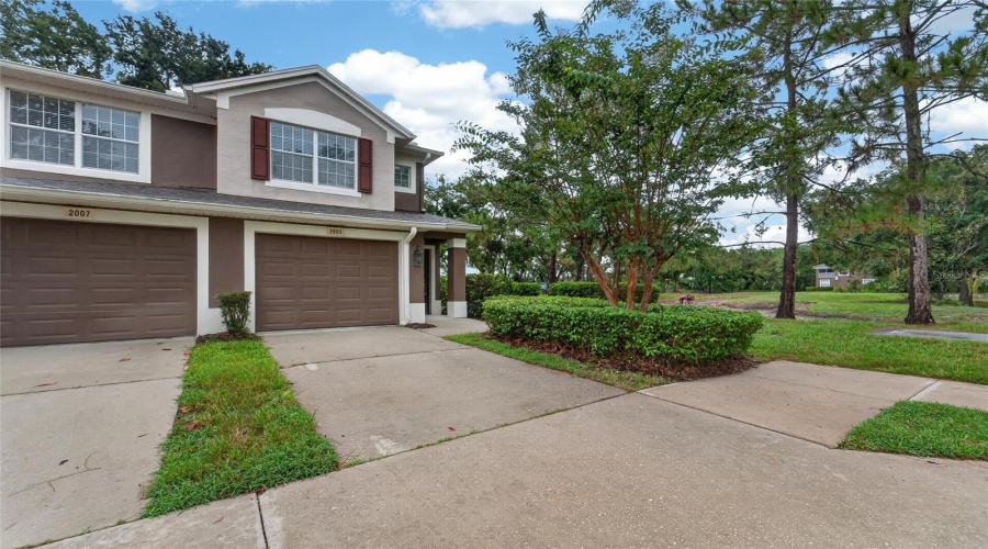 Front Of Condo With Sidewalks
