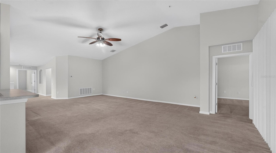Livingroom With Open Floor Plan To Dinette, Kitchen, And Dining Room