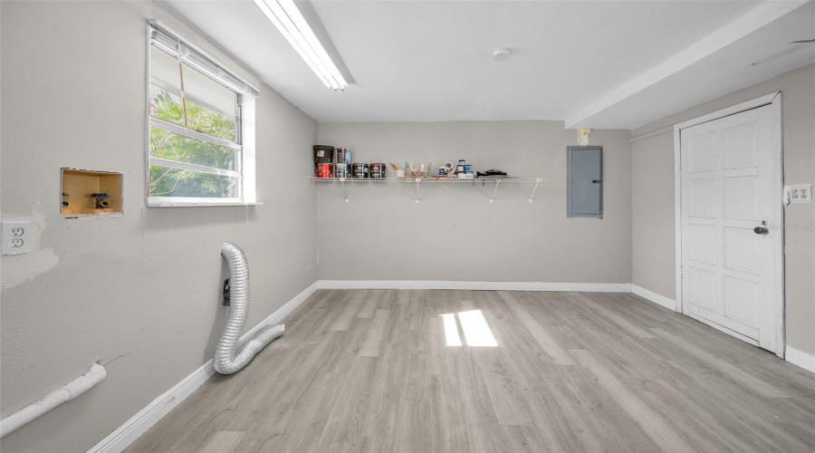Utility Room With Lots Of Storage And Laminate Floors