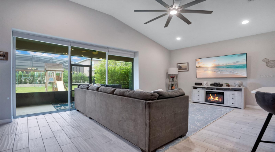 Family Room/ Sliding Door To Rear Screened In Patio