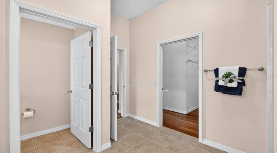 Primary Bath Area With Separate Shower, Private Water Closet, And Convenient Access To The Bedroom And Closet Spaces.