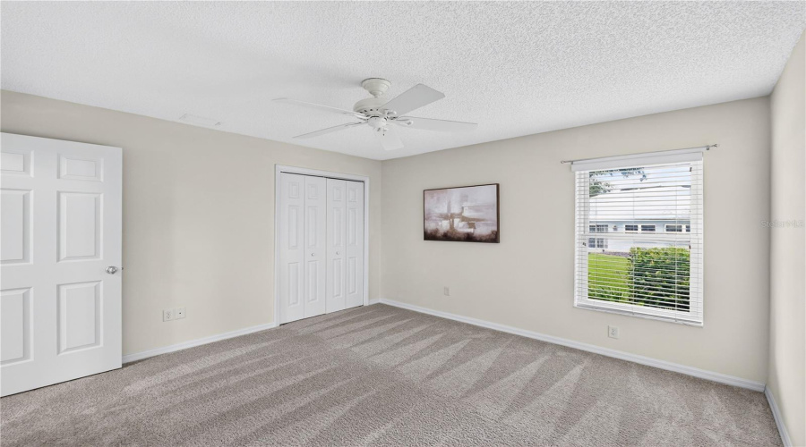 Comfortable Guest Bedroom With Neutral Tones, Window Views, And Flexible Space For Family, Visitors, Or Office Use. (Brand New Carpeting!)