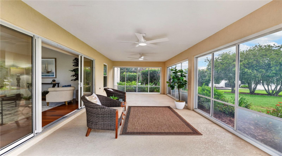 Spacious Lanai Offering Multiple Seating Areas, Natural Light, And A Peaceful Connection To The Surrounding Outdoor Views.