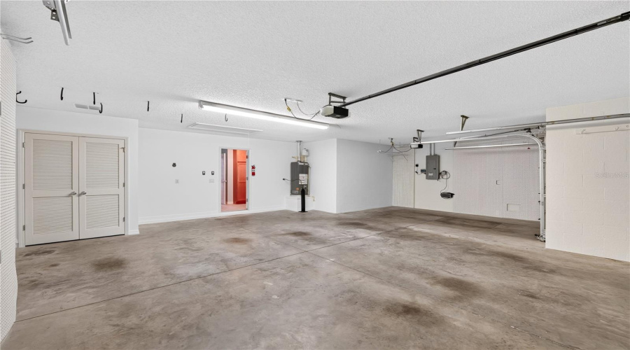Spacious Garage With Room For Golf Carts, Vehicles, Storage, Hobbies, Or Workspace, Plus Convenient Side/Service Door Access.