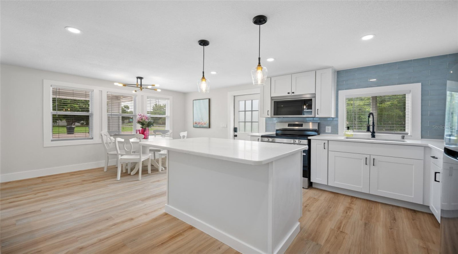 Completely Updated Kitchen With Breakfast Bar.