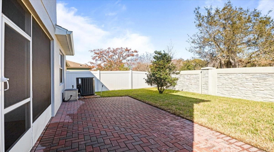Paver Lanai And Fenced Backyard