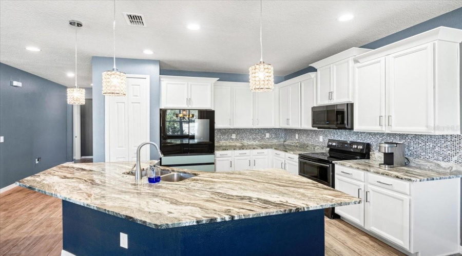 Large Kitchen With Granite Countertops