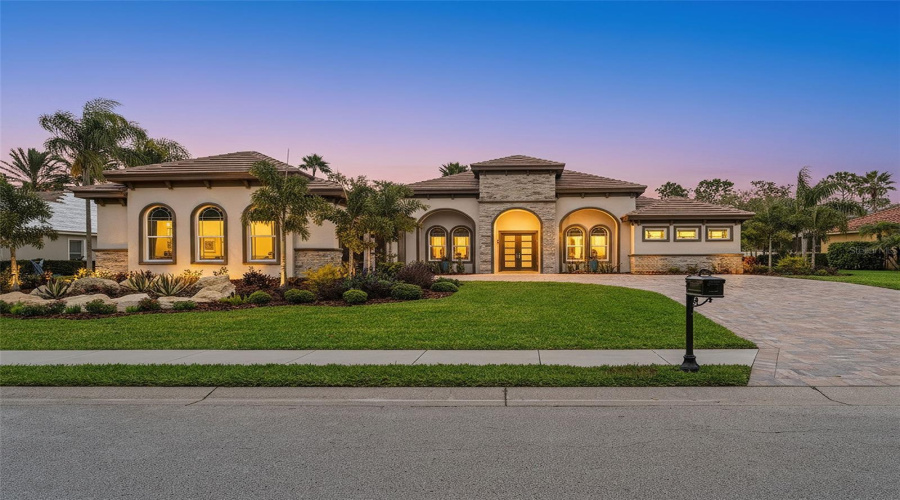 Home Front With Beatiful Landscaping.