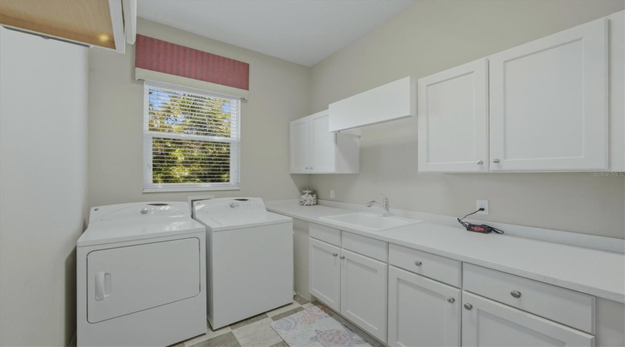 Spacious Laundry Room With Sink &Amp; Cabinetry