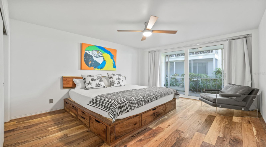 Spacious Bedroom With Enough Room For A Dedicated Seating Area. There Is Also An Entrance To Your Screened-In Patio Off Of This Room.