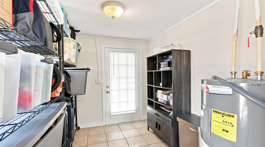 Mud/Accessory/Storage Room That Leads To Carport
