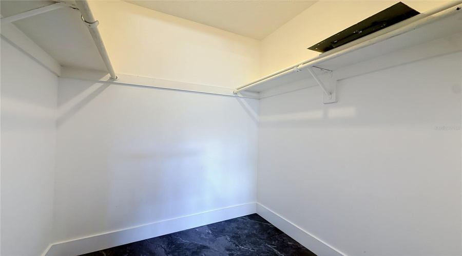 Walk-In Closet In Bedroom