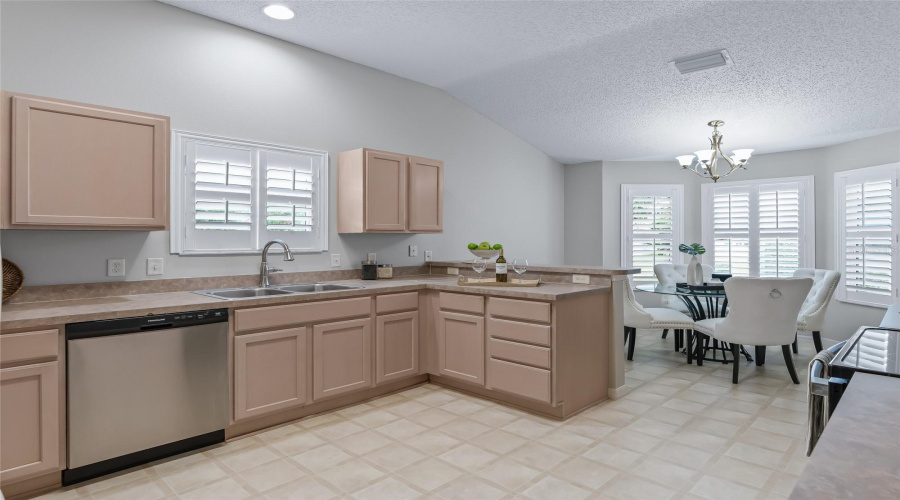 Open Kitchen And Breakfast Nook Combination Creates A Comfortable Gathering Space With Excellent Natural Light, Plantation Shutters, And Convenient Access To The Main Living Areas.