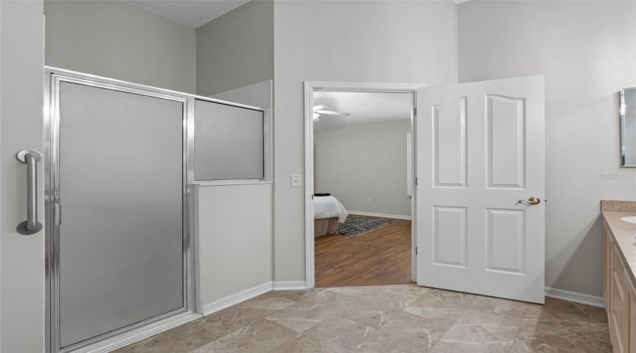 Walk-In Shower With Glass Enclosure Adds Convenience To The Primary Ensuite While Keeping The Space Bright And Open.