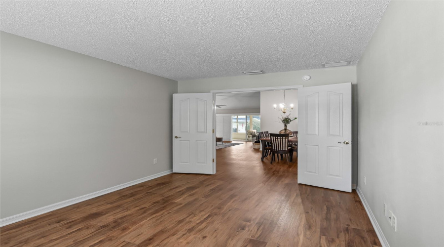 Versatile Non-Closeted Third Bedroom/Den With Double Doors And Lvp Flooring—Ideal As A Home Office, Hobby Room, Or Additional Guest Space.