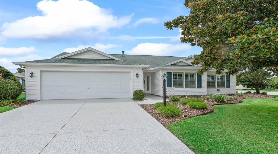 Front Exterior View Highlighting The Clean Architectural Lines, Newer-Looking Curb Appeal, And Low-Maintenance Textured Epoxy Driveway Leading To The Extra-Deep Garage.
