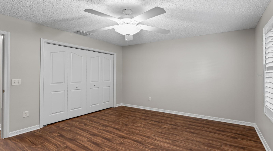 Guest Bedroom Includes A Full Closet, Ceiling Fan, And Plantation Shutters, Providing Excellent Flexibility For Overnight Visitors.