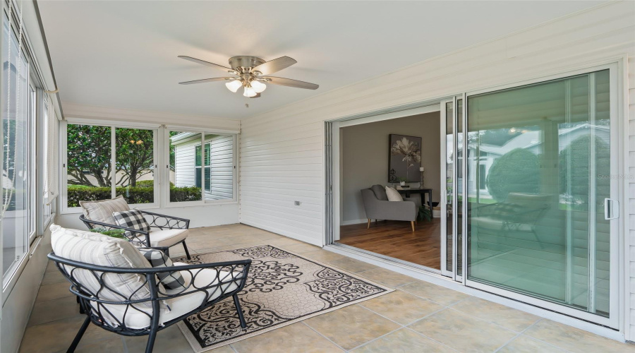 Enjoy Additional Living Space In The Enclosed, Tiled Lanai, Complete With A Ceiling Fan And Plenty Of Room For Comfortable Seating Or Entertaining.