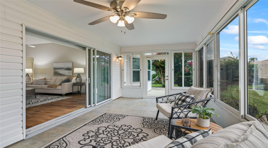 Another View Of The Enclosed Lanai Shows Its Easy Connection To The Main Living Area And Wonderful Natural Light From Multiple Windows.