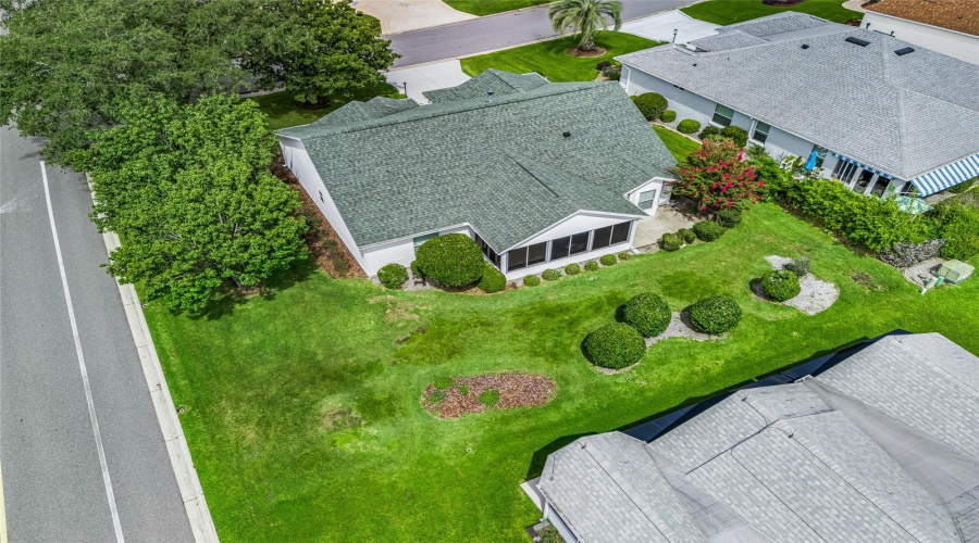 Overhead Aerial Highlights The Generous Corner Homesite, Established Landscaping, And Additional Outdoor Space Surrounding The Home.