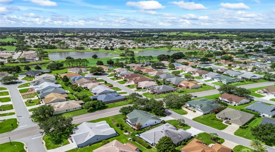 Wide Aerial View Captures The Surrounding Neighborhood And The Home’s Desirable Position Within The Community.