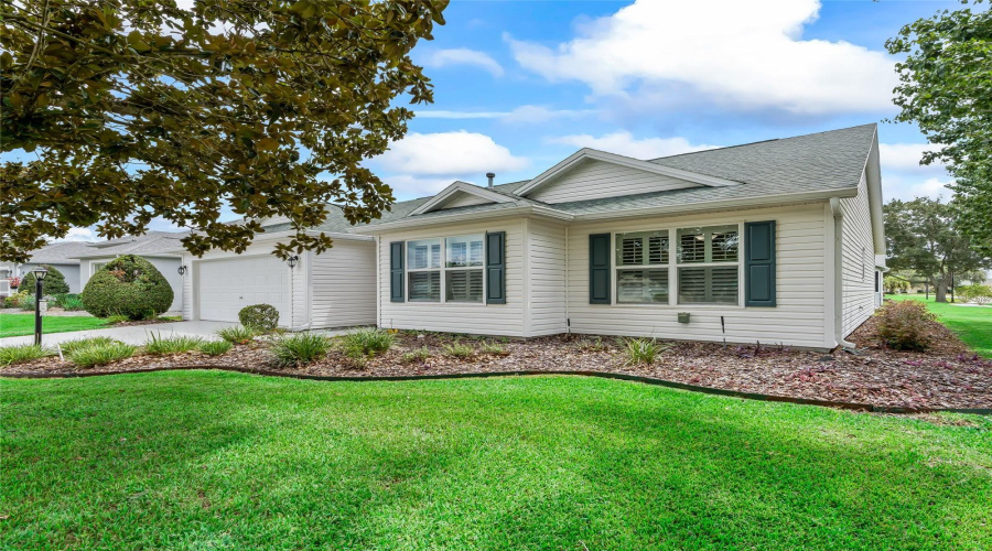 Beautifully Maintained Corner Lot With Established Landscaping, Lush Lawn, And Mature Trees Providing An Attractive, Peaceful Setting.