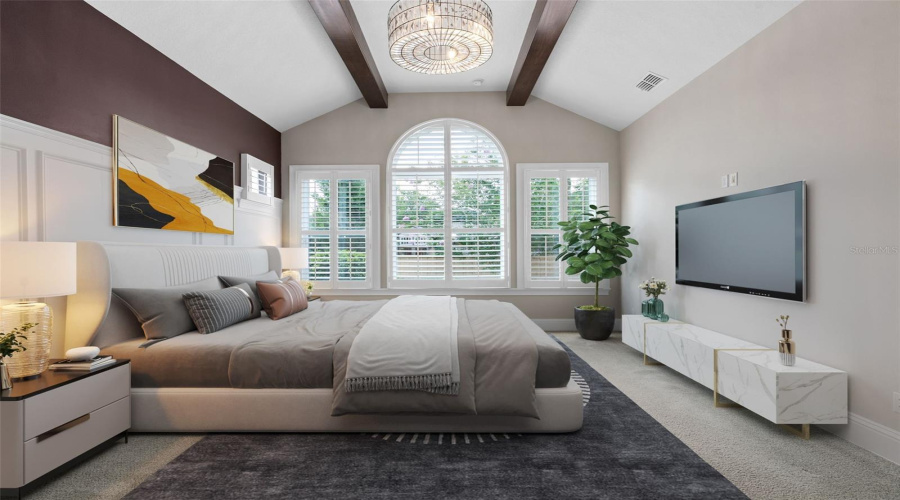 Primary Bedroom With Wood Beam Ceilings