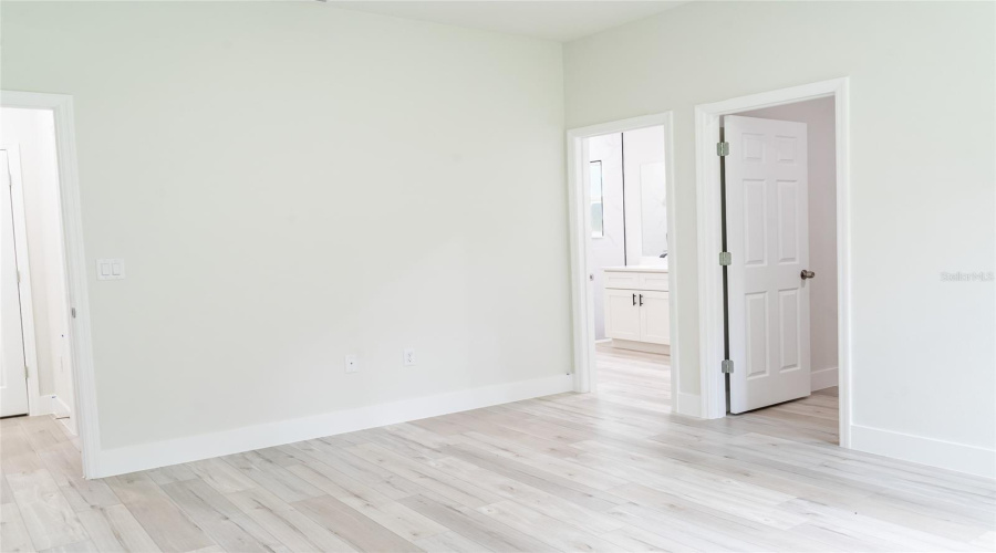 Primary Bedroom With Walk-In Closet And Ensuite Bath
