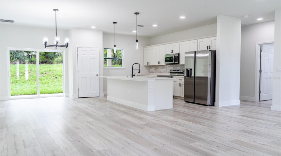 Kitchen And Dining Area From Front Entry