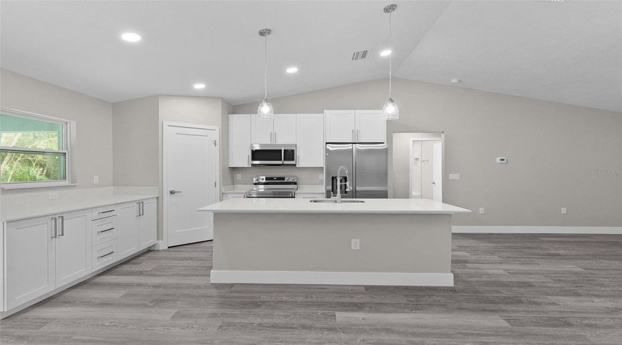 Kitchen Island Also Serves As A Breakfast Bar