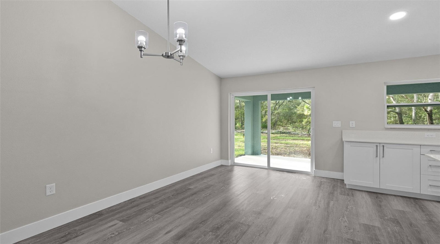 Dining Area With Sliding Door To Covered Rear Lanai