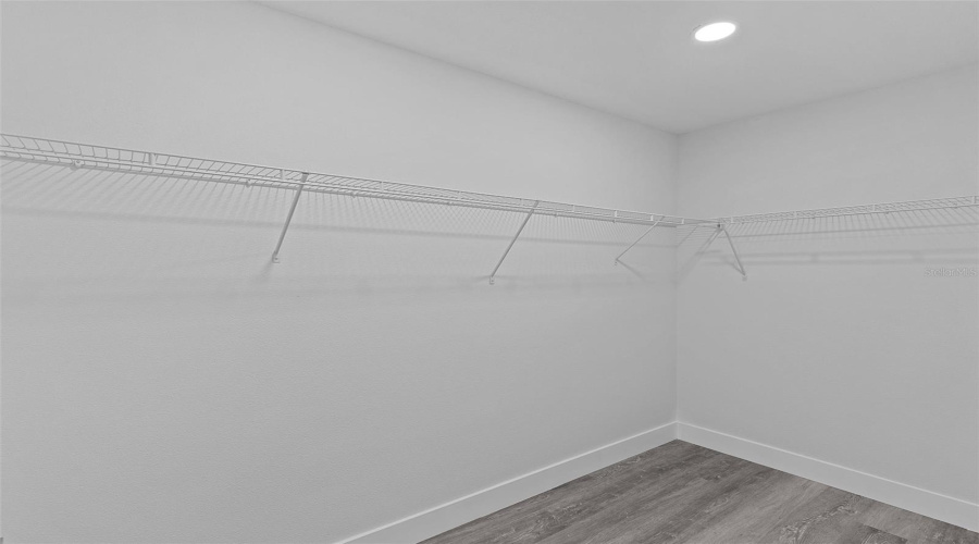 Walk-In Closet In Primary Bedroom