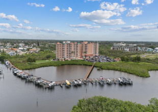 8th floor condo with Boat lift/slip #25-Aerial view of Marina looking north towards complex