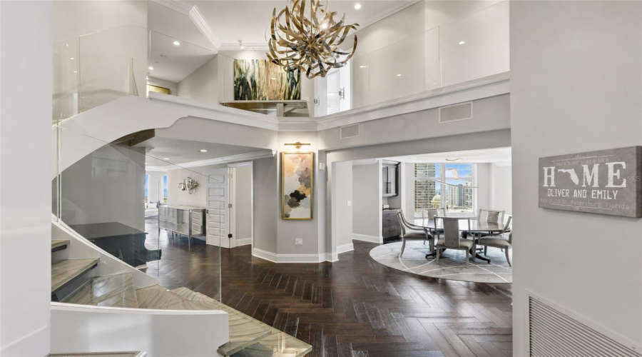 Greeted By A Two-Story Great Room, 1900 Is A Two Story Penthouse That Has Been Completely Renovated With Gorgeous Walnut Herringbone Floors.
