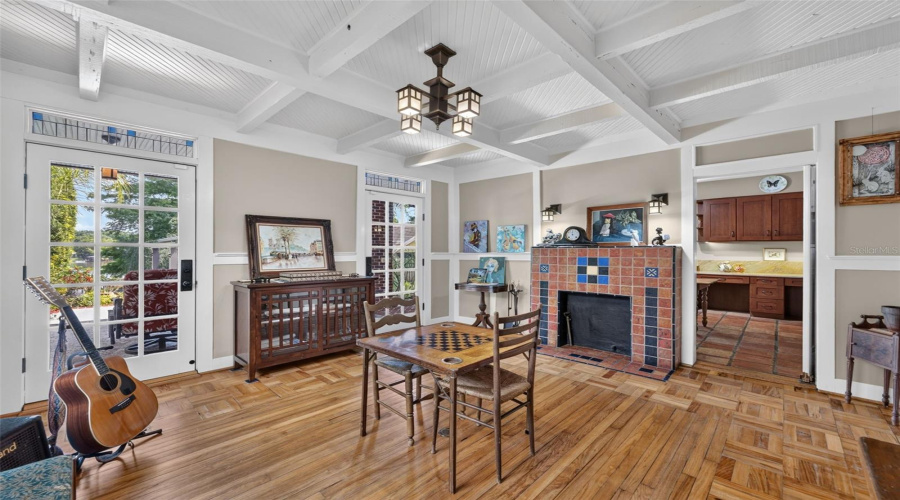 Beautiful Parquet Floors And Stained Glass Windows Along With Coffered Ceilings Create Cozy Casual Living Room Or Music Room For Entertaining