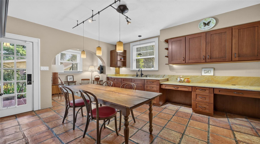 Former Full Kitchen On Lower Level Offers Wet Bar/Dining Area Plus Cozy Sitting Area In Alcove. Leads To Finished Basement, Laundry Room, Expansive Storage And Driveway Entry Door