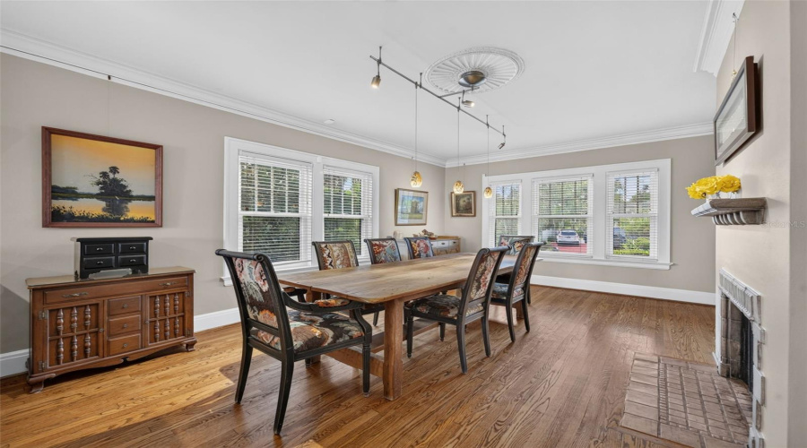Expansive Wood Trimmed Windows, Crown Mounding And Picture Rail Throughout