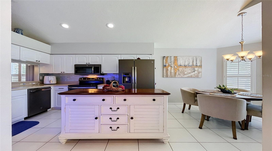Off The Foyer Is Entrance To Kitchen