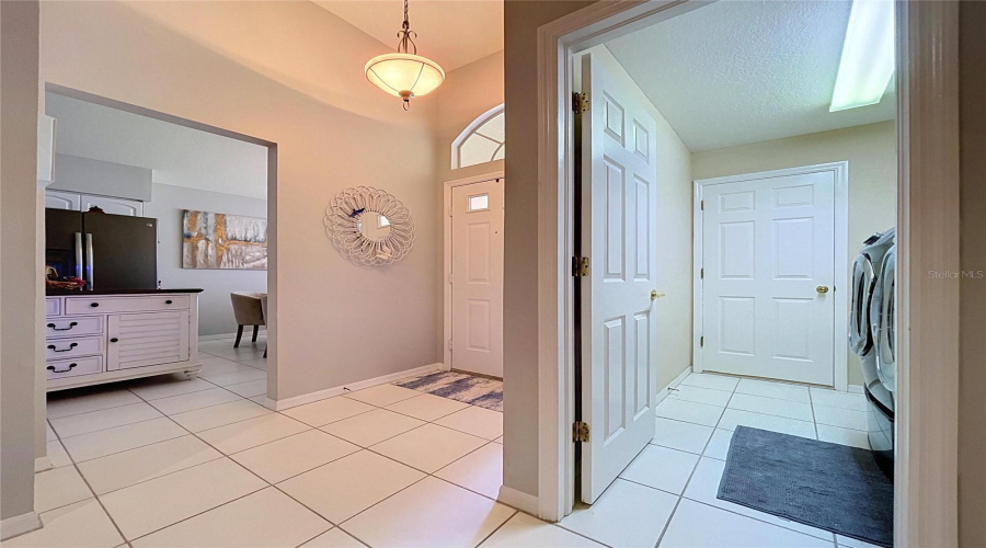 Off Of Foyer Is Entrance To Laundry